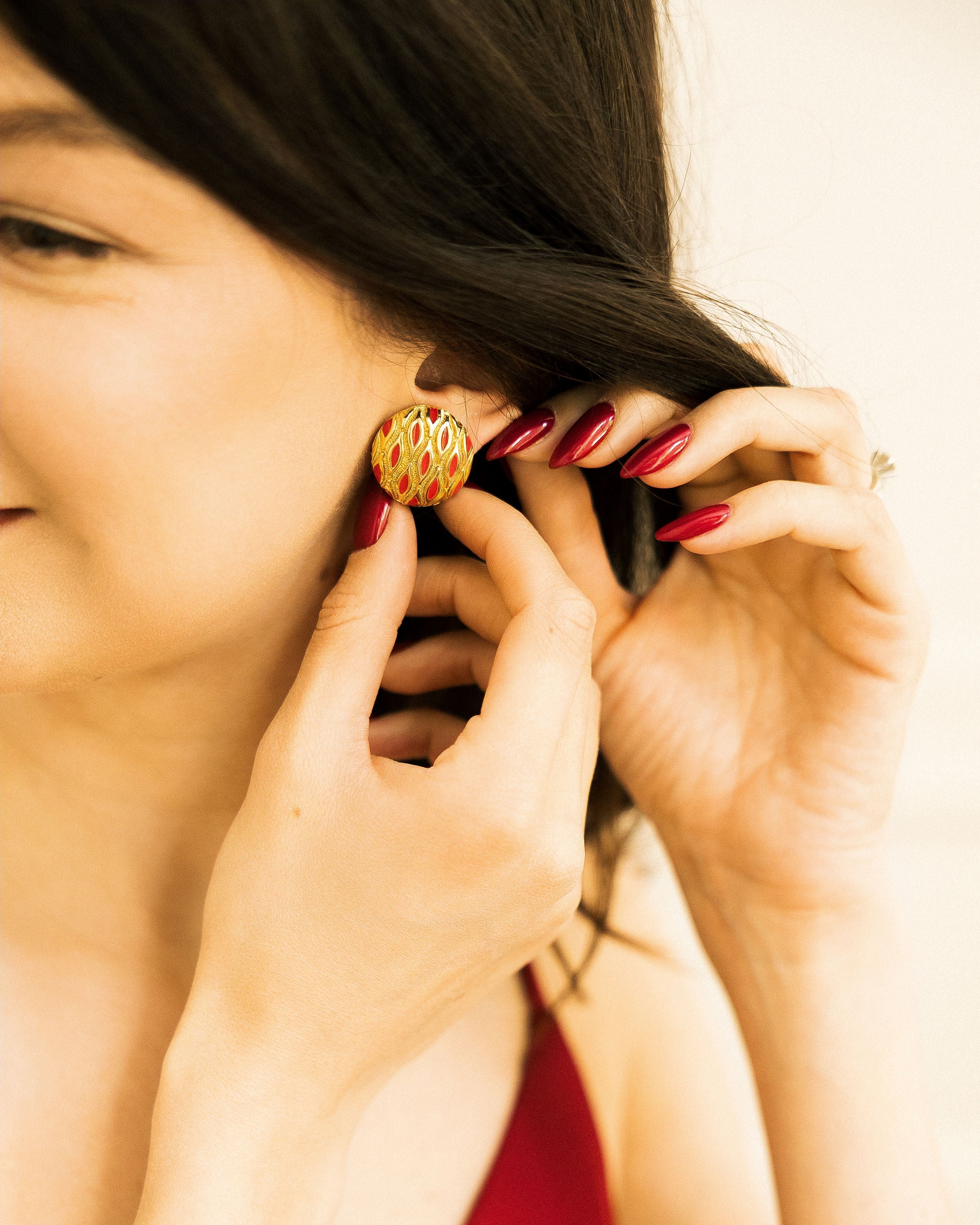 Vintage Gold and Red Clip-On Earring worn close-up