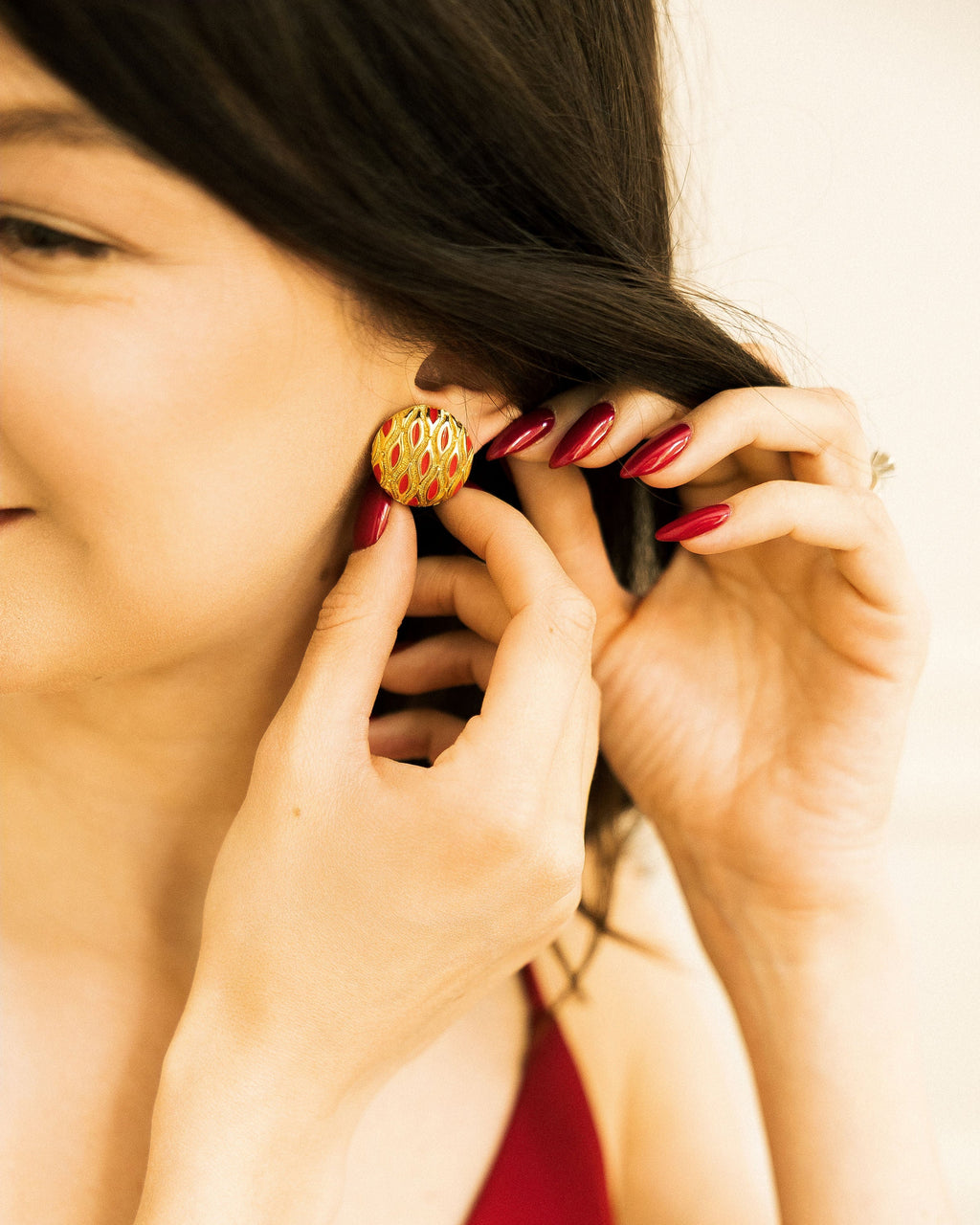 Vintage Gold and Red Clip-On Earring worn close-up