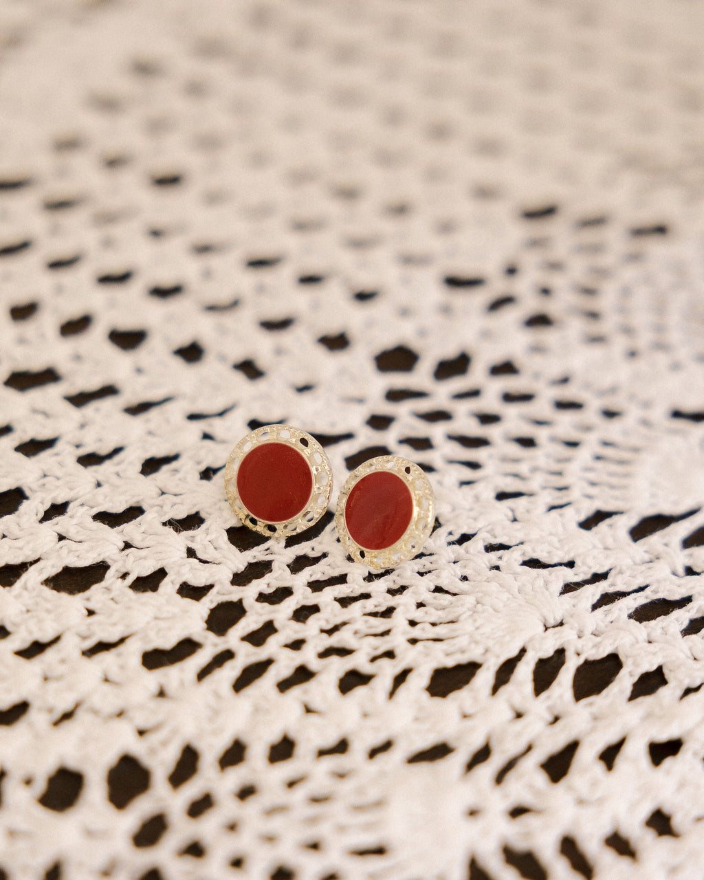 Vintage Red & Silver Stud Earrings pair on black and white crochet lace cloth